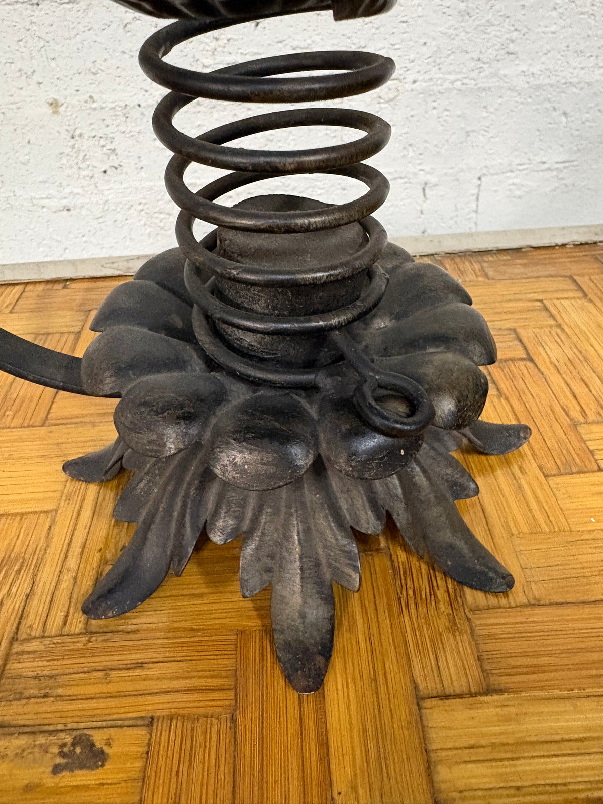 Wrought-Iron Brutalist Spring Candlestick with Floral Base and Scroll Handle, c.1920s
