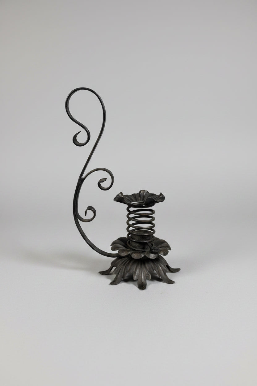 Wrought-Iron Brutalist Spring Candlestick with Floral Base and Scroll Handle, c.1920s
