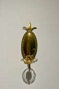 Embossed brass wall sconce