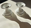 Two ceramic candlestick holders